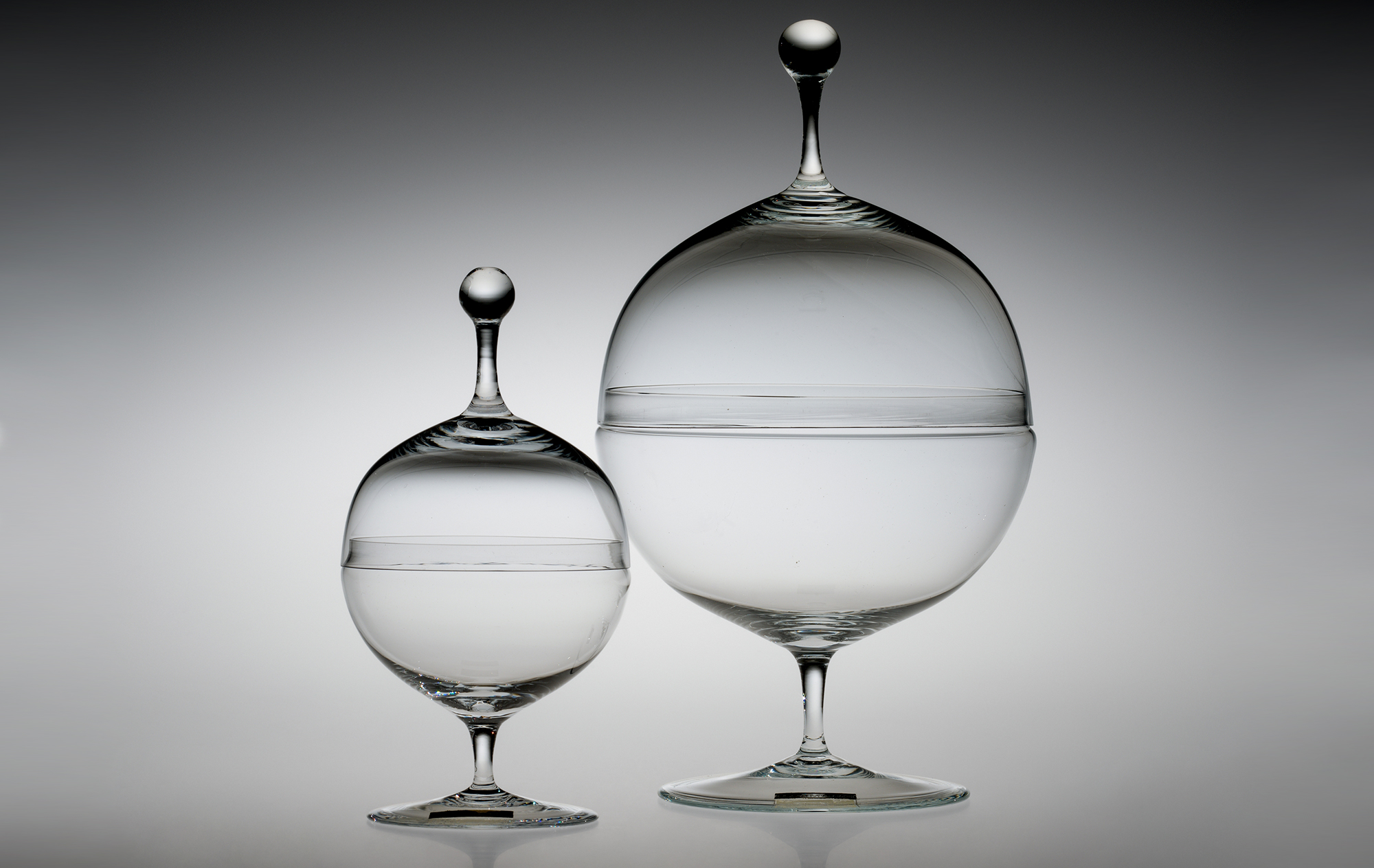 Candy Dishes, designed 1925. Designed by Oswald Haerdtl (Austrian, 1899–1959); manufactured by J. & L. Lobmeyr. Mold-blown and hot-worked Muslin glass. H. 22.9 cm, Diam. 12.7 cm; H. 15.3 cm, Diam. 7.7 cm. The Corning Museum of Glass (64.3.43).